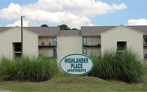 Fayetteville apartment for rent - The sign in front of the building says Highlander Place Apartments.