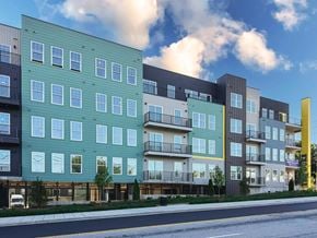 Asheville apartment for rent - A modern apartment building with balconies and multiple stories.