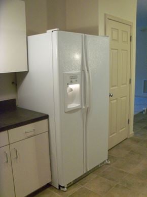 Durham apartment for rent - A white refrigerator with a water and ice dispenser in the middle of the door.