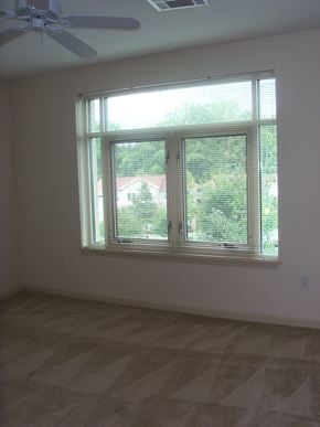 Durham apartment for rent - A room with a window and a ceiling fan.