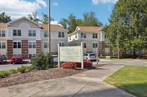 Durham apartment for rent - A building with a sign that says "Parker House" in front of it.