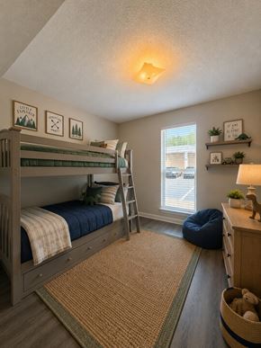 Fayetteville apartment for rent - A bedroom with a bunk bed and a window.
