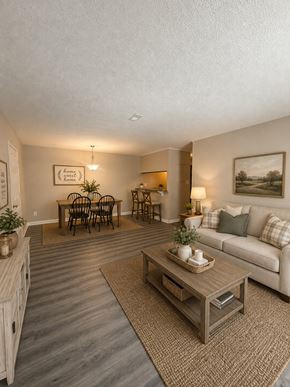 Fayetteville apartment for rent - A living room with a couch, coffee table, and chairs.
