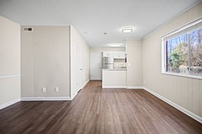Fayetteville apartment for rent - A kitchen area with wood flooring and white walls.