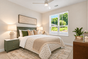 Greensboro apartment for rent - A bedroom with a bed, nightstand, and window.