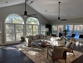 Asheville apartment for rent - A living room with a white couch, a coffee table, and a rug.