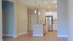 Kernersville apartment for rent - A kitchen with a white island and stainless steel appliances.