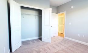 Kernersville apartment for rent - A room with a white door and a carpeted floor.