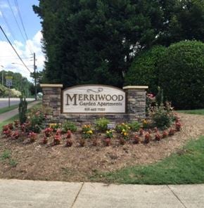Cary apartment for rent - a sign for the merrwood garden appointment on the side of a street