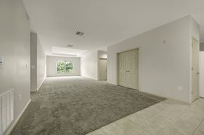 Durham apartment for rent - A spacious room with a carpeted floor and tiled walls.