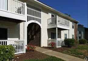 Cary apartment for rent - an apartment building with a balcony and a walkway