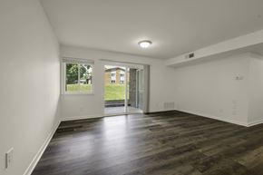Durham apartment for rent - A room with wooden floors and white walls.