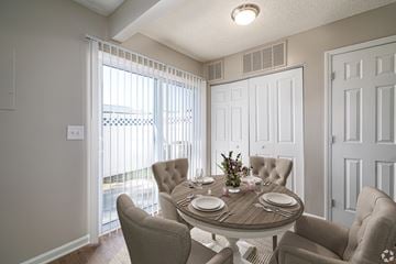 Creedmoor apartment for rent - A dining room with a round table set for four.
