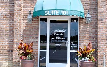 Fayetteville apartment for rent - A building with a green awning and a sign that says "SUITE 101".