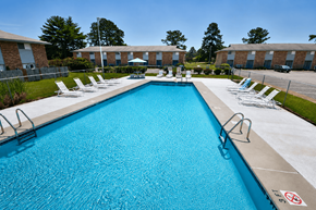 Fayetteville townhouse for rent - A large blue swimming pool with a no-diving sign.
