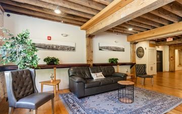 Lynchburg apartment for rent - a living room with a leather couch and a rug