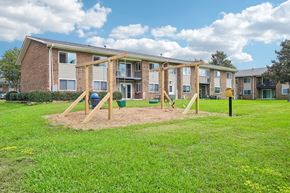 Durham apartment for rent - A playground in front of apartment buildings.