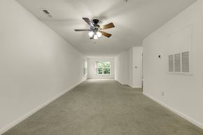 Durham apartment for rent - A room with a ceiling fan and carpeted floor.