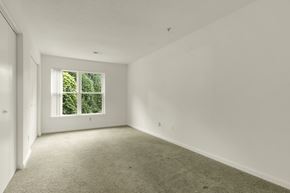 Durham apartment for rent - A room with a window and carpeted floor.