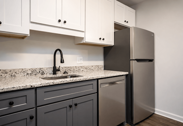 Concord apartment for rent - A kitchen with a sink and a refrigerator.