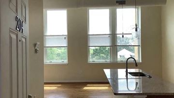 Lynchburg apartment for rent - a kitchen with a sink and three windows