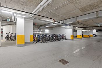 Bike rack stations located at the underground parking structure