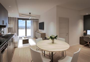 Ottawa apartment for rent - A modern kitchen with a dining table and chairs.
