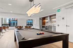 Ottawa apartment for rent - A pool table in a room with a view of the city.