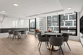 Ottawa apartment for rent - A modern dining room with a large table and chairs.