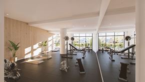 Ottawa apartment for rent - A gym with a variety of equipment and a view of the outside.