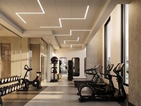 Ottawa apartment for rent - A gym with treadmills, elliptical machines, and dumbbells.