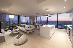 Ottawa apartment for rent - a living room with a kitchen and a view of the city