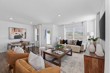 Hickory townhouse for rent - A living room with a brown sofa and a coffee table.