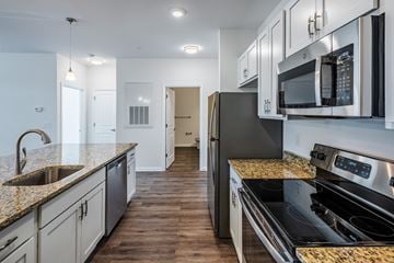 Charlotte apartment for rent - a kitchen with granite counter tops and stainless steel appliances