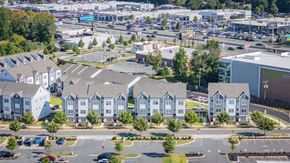 Charlotte townhouse for rent - A view of a parking lot with a building that has the words "Extraspace" on it.