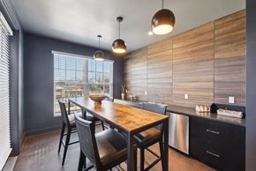 Rock Hill apartment for rent - A kitchen with a wooden table and chairs.