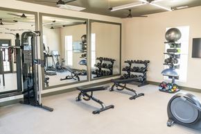 Hickory townhouse for rent - a fitness center with weights and other exercise equipment at Landon Green Artisan Cottages Apartments, Hickory