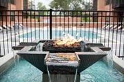 Rock Hill apartment for rent - a fire pit in front of a pool with a fence