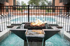 Rock Hill apartment for rent - a fire pit in front of a pool with a fence