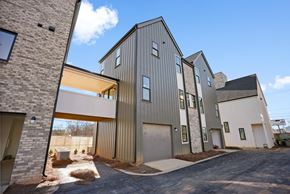 Charlotte townhouse for rent - A modern building with a mix of materials including wood and metal.