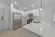 Spartanburg apartment for rent - a kitchen with white cabinets and a white counter top at The Fitzgerald, Spartanburg