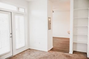 Charlotte apartment for rent - a bedroom with white walls and a closet with white doors