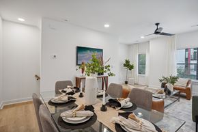Charlotte apartment for rent - A dining room with a glass table set for a meal.