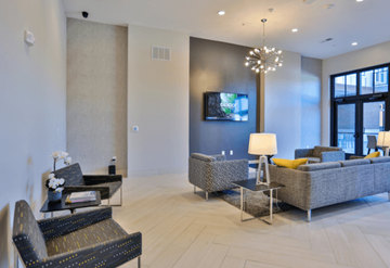 Hickory apartment for rent - a living room with couches and chairs and a television