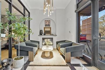 Cornelius apartment for rent - A living room with a grey couch and a fireplace.