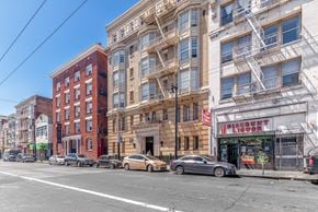 San Francisco apartment for rent - A street view with cars parked and buildings on the side.