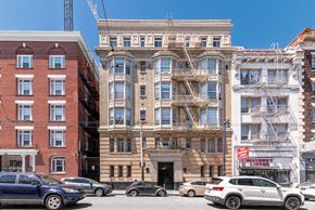 San Francisco apartment for rent - A row of buildings with cars parked in front.
