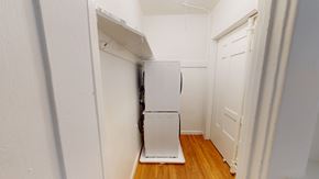 San Francisco apartment for rent - A white refrigerator in a narrow hallway.