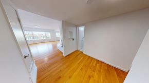San Francisco apartment for rent - A room with wooden floors and white walls.