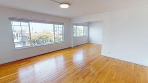 San Francisco apartment for rent - A room with wooden floors and white walls.